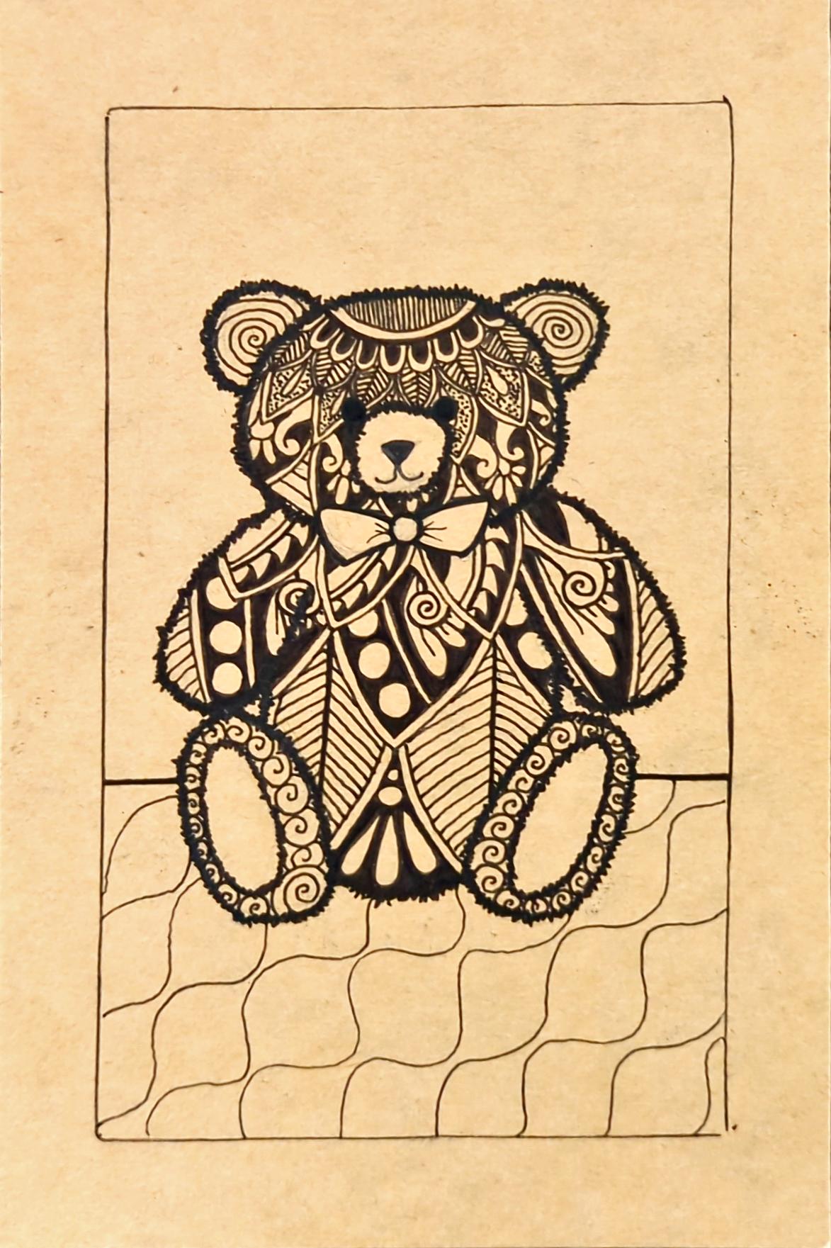 Drawing of a teddy bear with henna patterns on it.